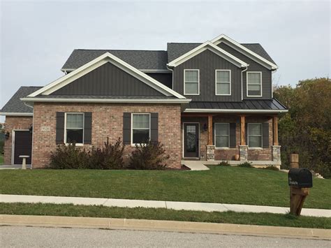 red brick house with pewter grey metal roof|metal roof for red brick house.